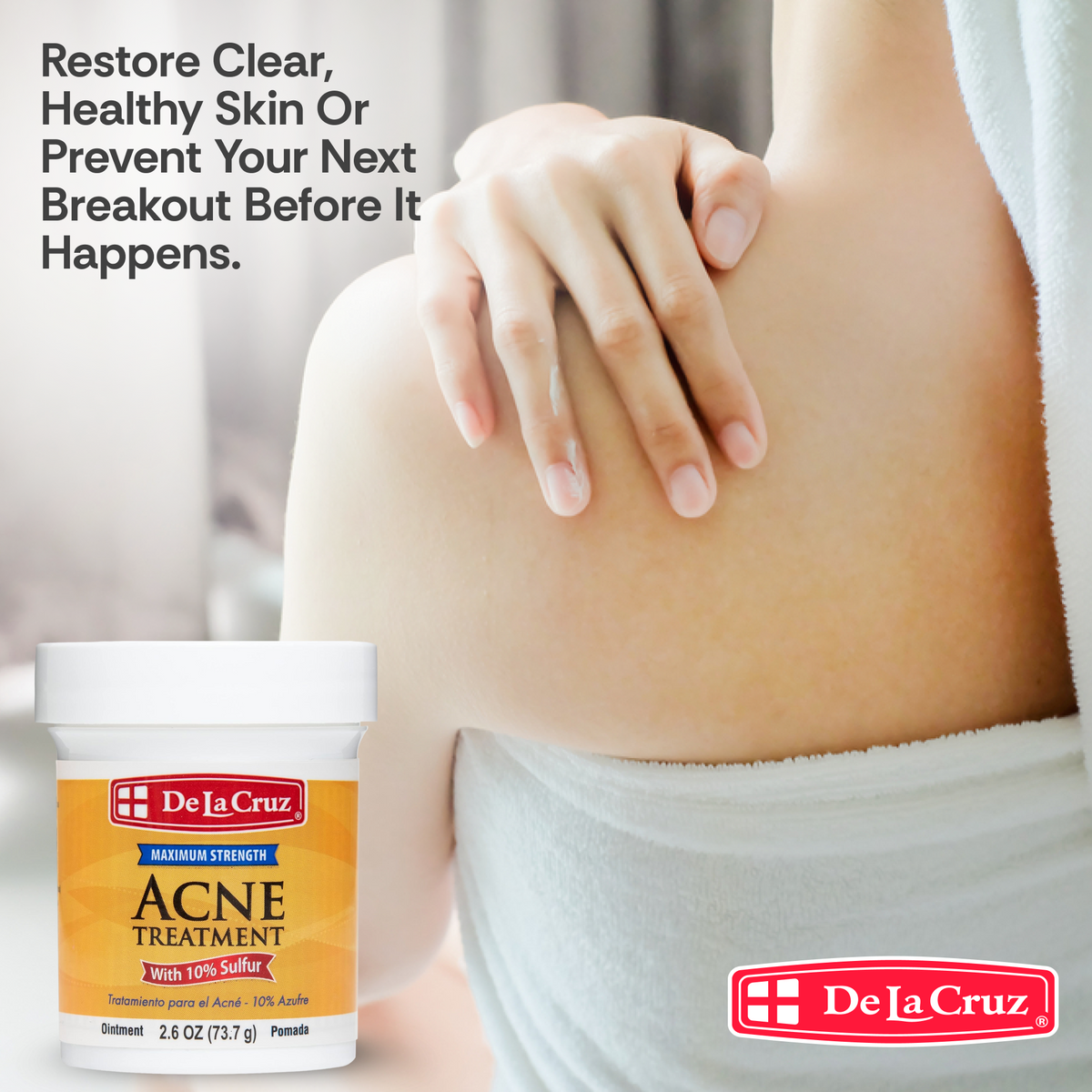 A jar of De La Cruz Acne Treatment is shown next to a person's upper back and shoulder, with a towel draped around the shoulders. Text at the top reads, 'Restore Clear, Healthy Skin Or Prevent Your Next Breakout Before It Happens.