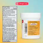 A De La Cruz branded Drug Facts label for a red and white acne medication gel, showing usage instructions, warnings, and directions on a gradient background.