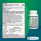 Bottle of De La Cruz medication with drug facts label on a green background